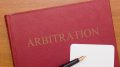 Image: Code of Arbitration - the book and business card for a lawyer.